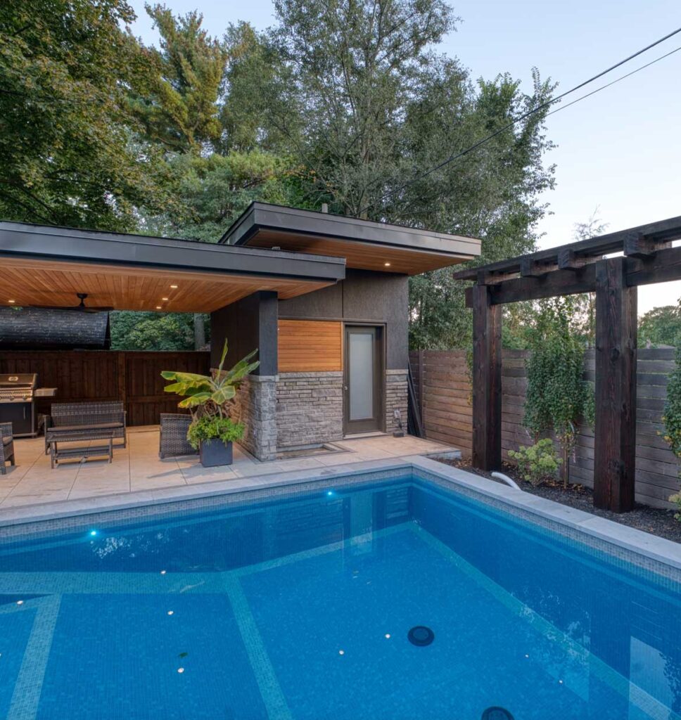 modern backyard with a tile pool, very modern pool house with roof overhang