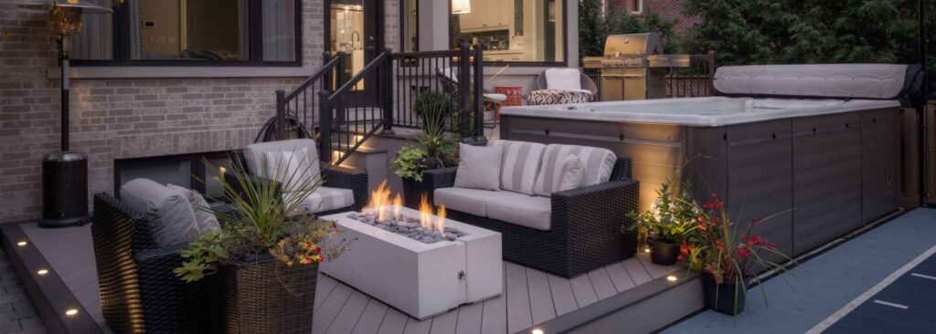 Multi-level deck around a swim spa providing convenient access from the house and defined outdoor spaces