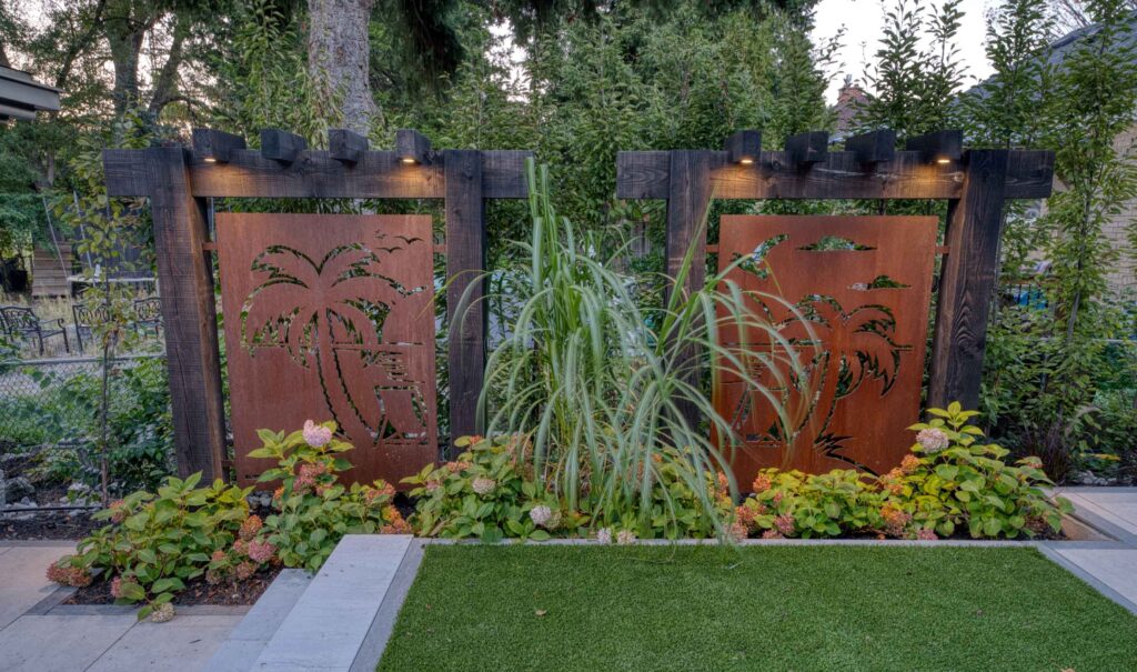 Backyard privacy created with custom panels and trees for a blend of screening and natural greenery