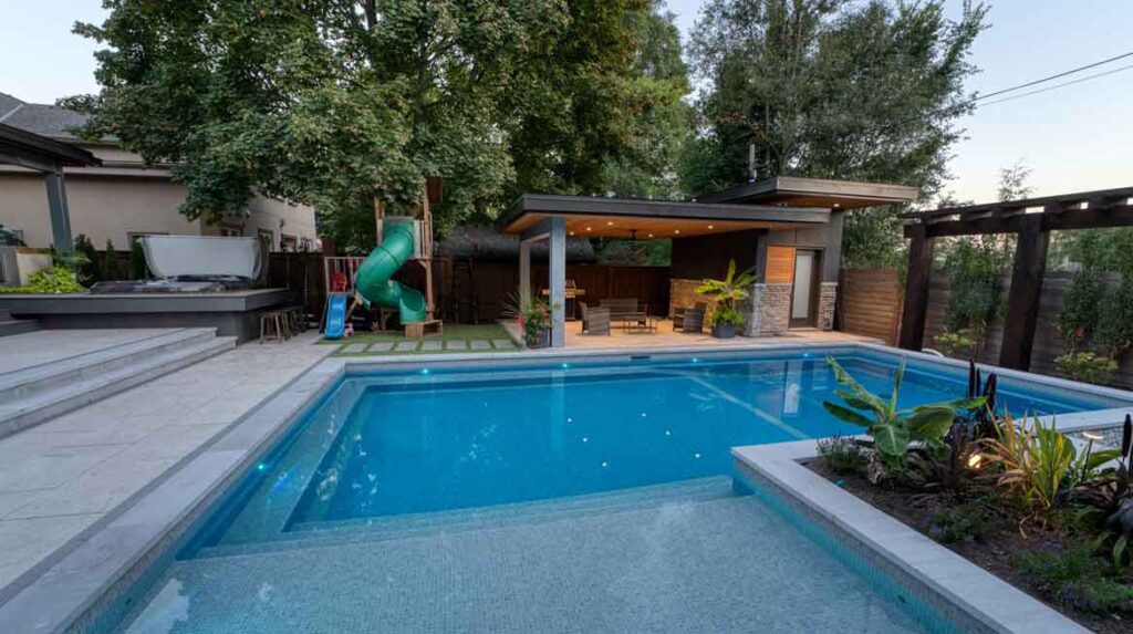 sloped backyard with a pool incorporated into design