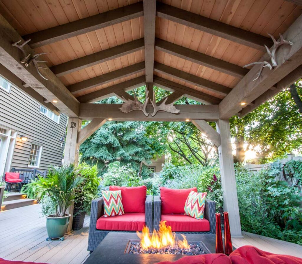 timber roof over top of pvc deck with seating and firepit in etobicoke